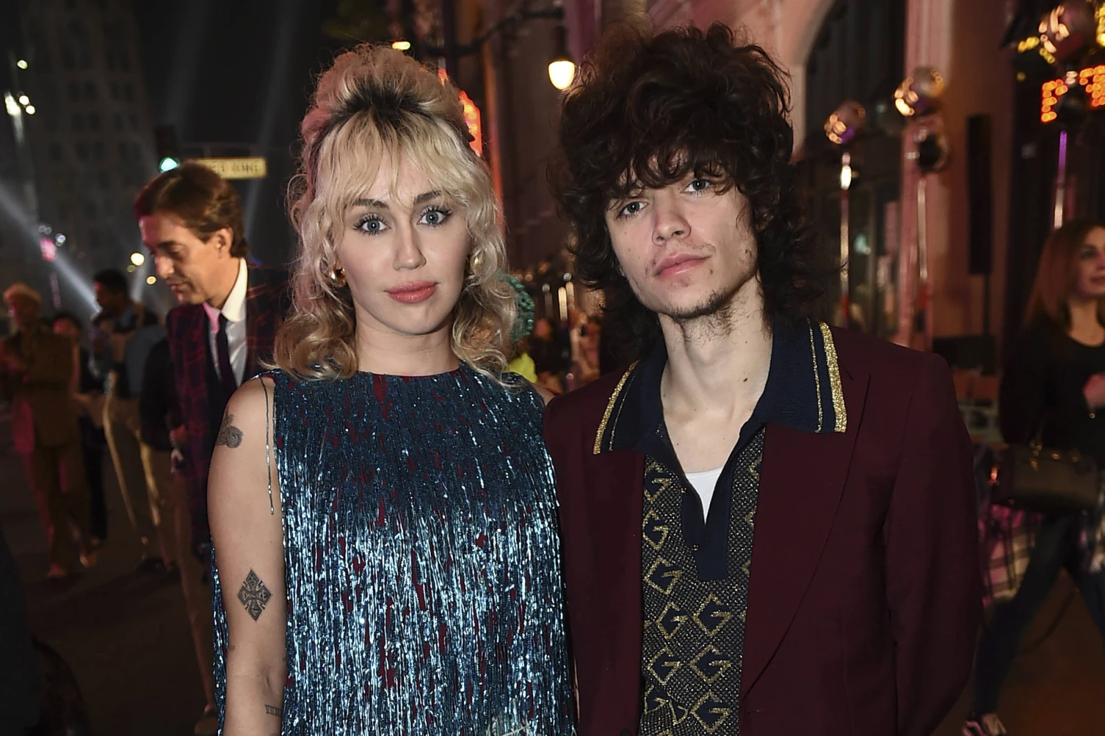 Miley Cyrus, left, and Maxx Morando attend the Gucci “Love Parade” fashion show on Tuesday, Nov. 2, 2021, in Los Angeles. (Photo by Jordan Strauss)